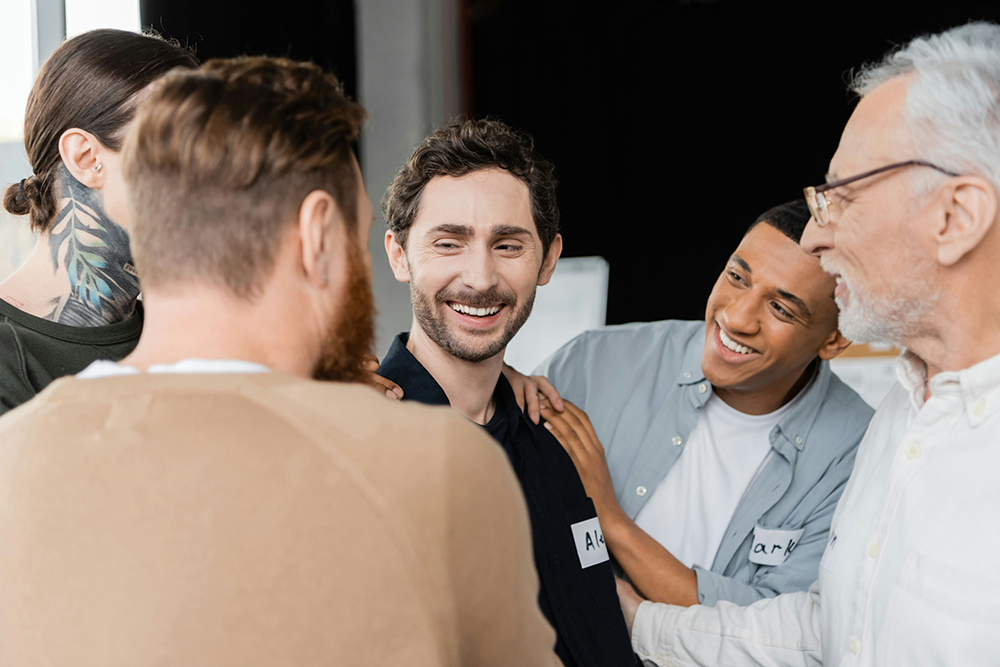 group of patients with specialist discussing in addiction therapy
