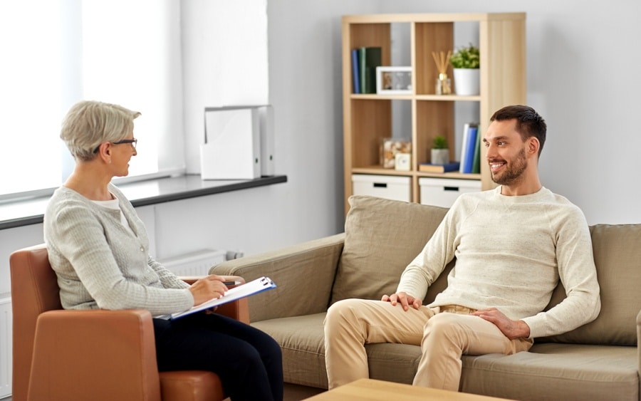 Case manager meeting with a client to discuss individualized recovery plans