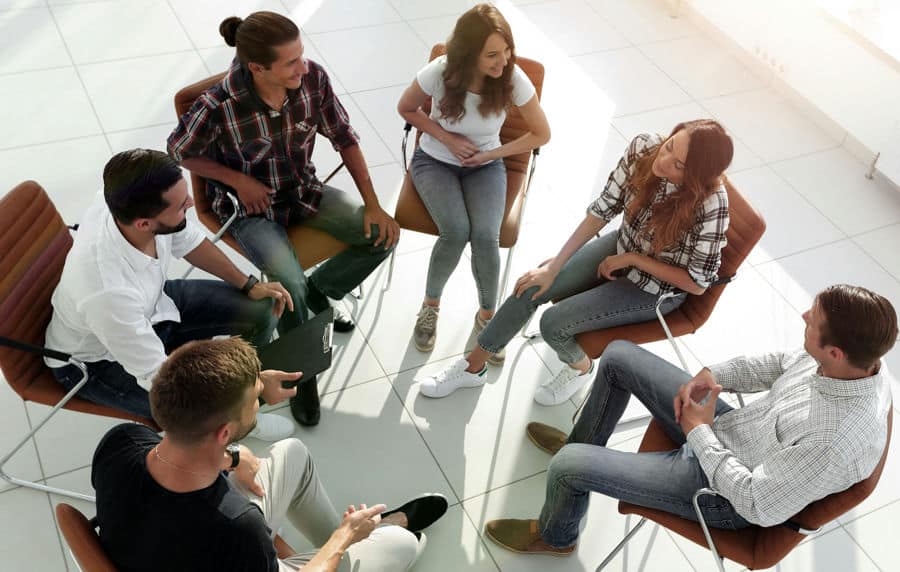 a group of individuals in therapy session