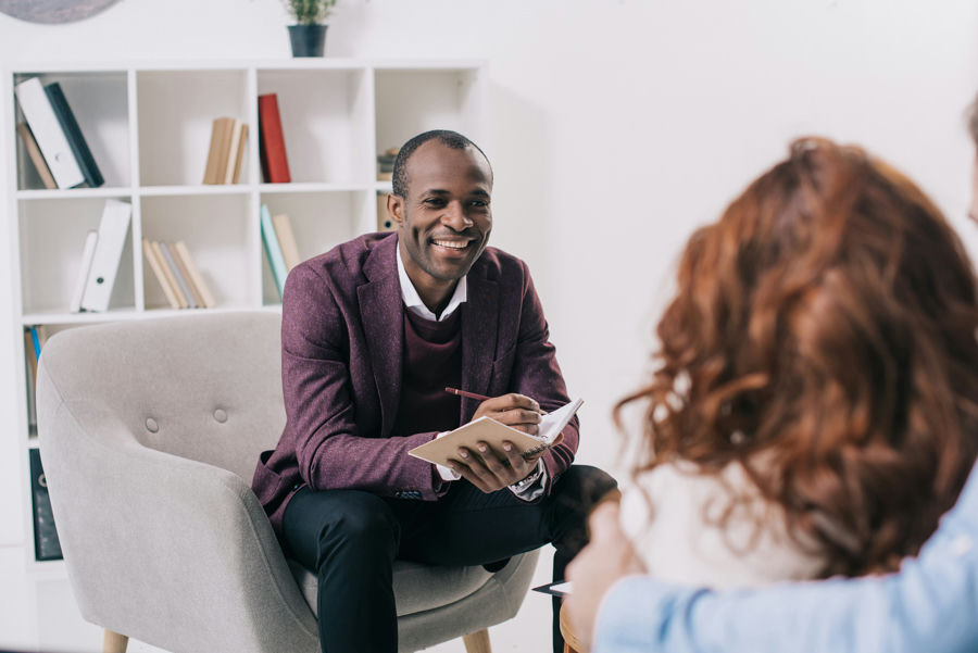 A smiling therapist in substance abuse treatment in New Jersey.